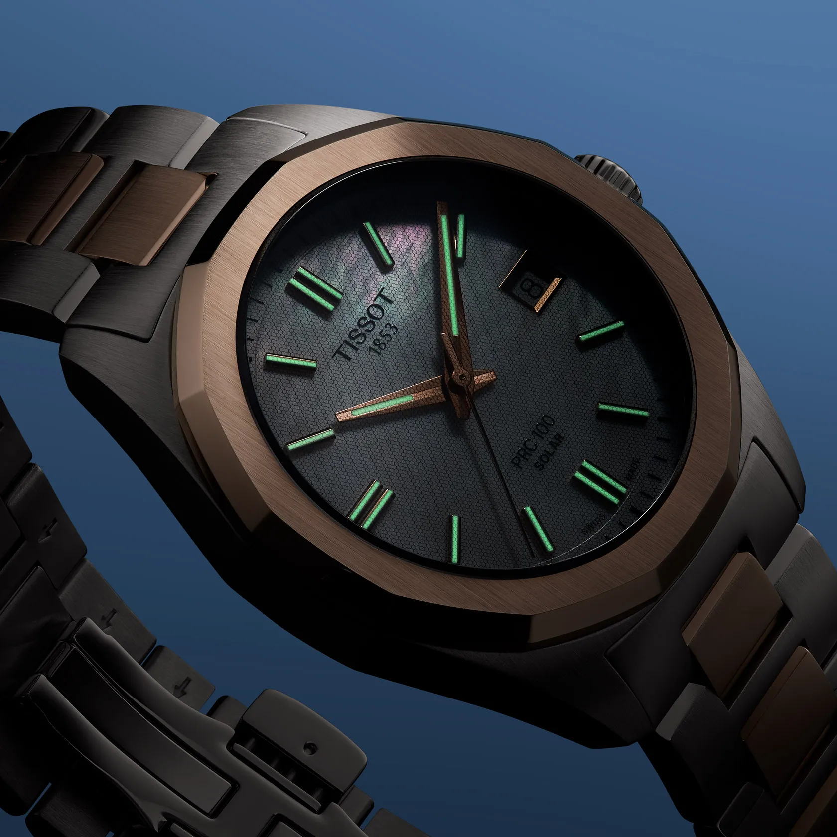 Tissot PRC 100 Solar Quartz 34mm watch on a colored background