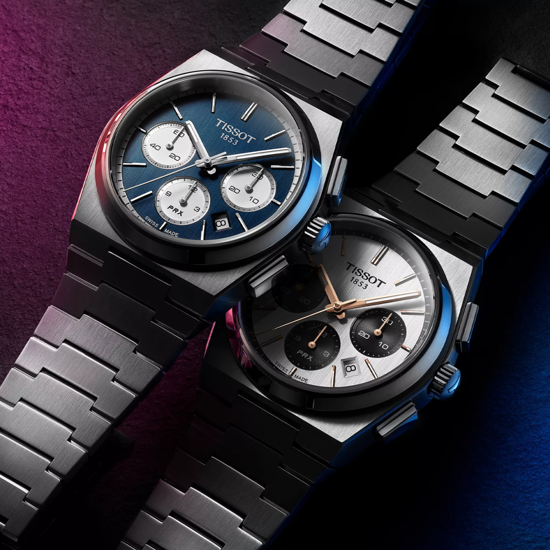 Tissot PRX Automatic Chronograph 42mm watch on a colored background
