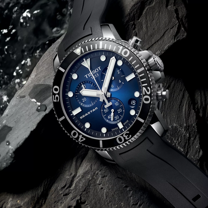 Tissot Seastar 1000 Chronograph watch on a coloured background