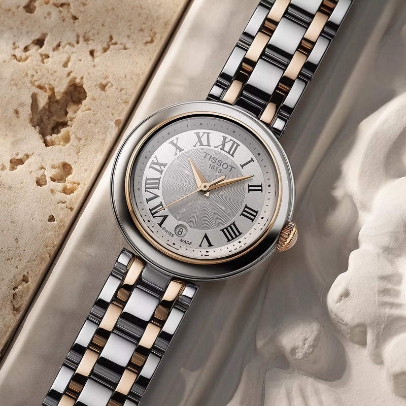 Tissot Bellissima Small Lady watch on a colored background