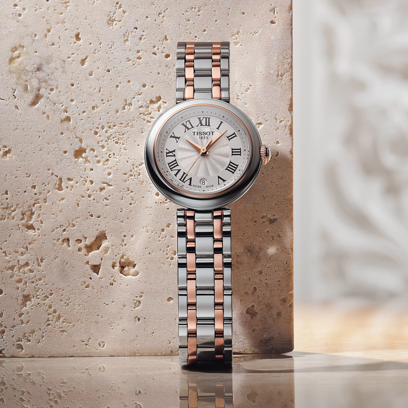 Tissot Bellissima Small Lady watch on a colored background