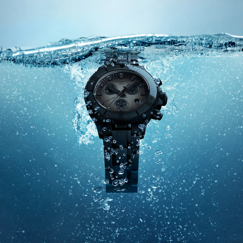 Tissot Seastar 1000 Quartz Chronograph 38mm watch on a colored background