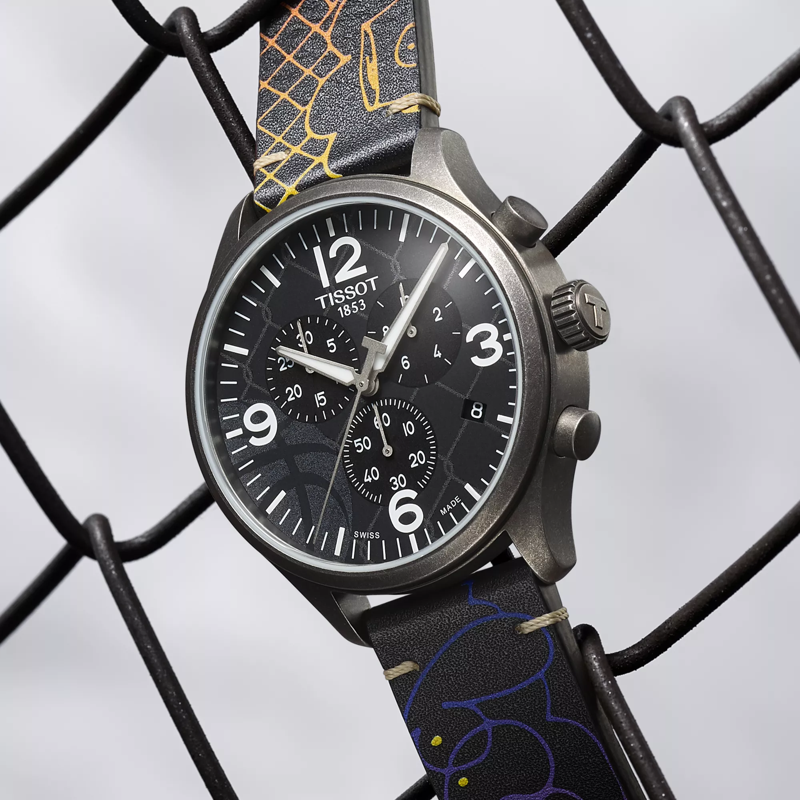 Tissot Chrono XL 3x3 Street Basketball watch on a colored background