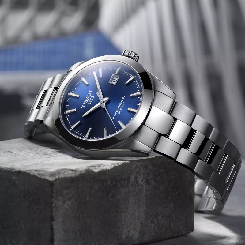 Tissot Gentleman Powermatic 80 Silicium watch on a colored background