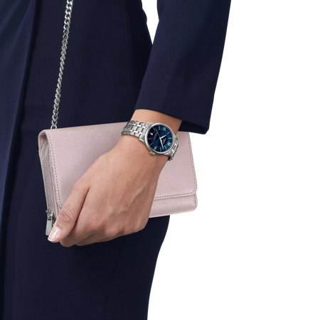 Simulation of the watch 티쏘 슈망 데 뚜렐 파워매틱 80 34 mm on a wrist