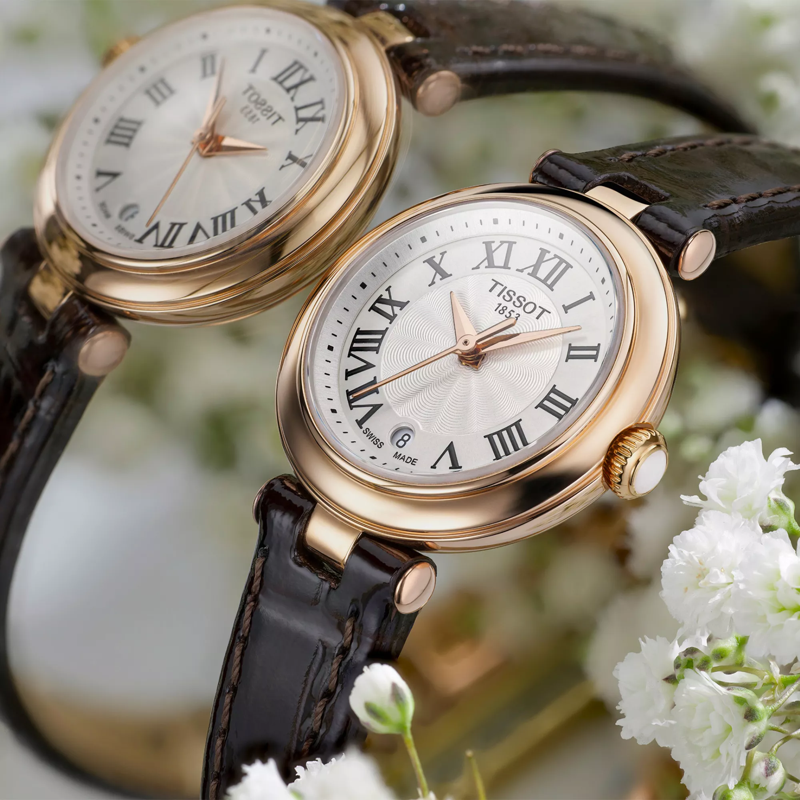 Tissot Bellissima small lady watch on a colored background