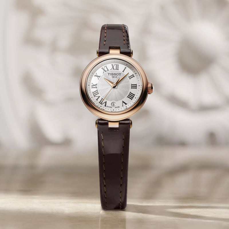 Tissot Bellissima small lady watch on a colored background