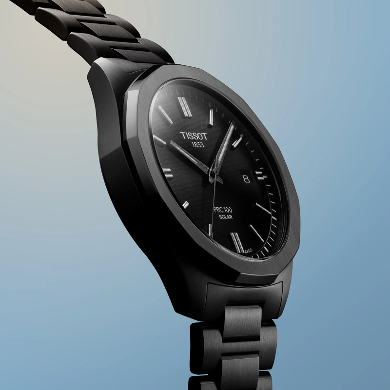 Tissot PRC 100 Solar Quartz 39mm watch on a colored background