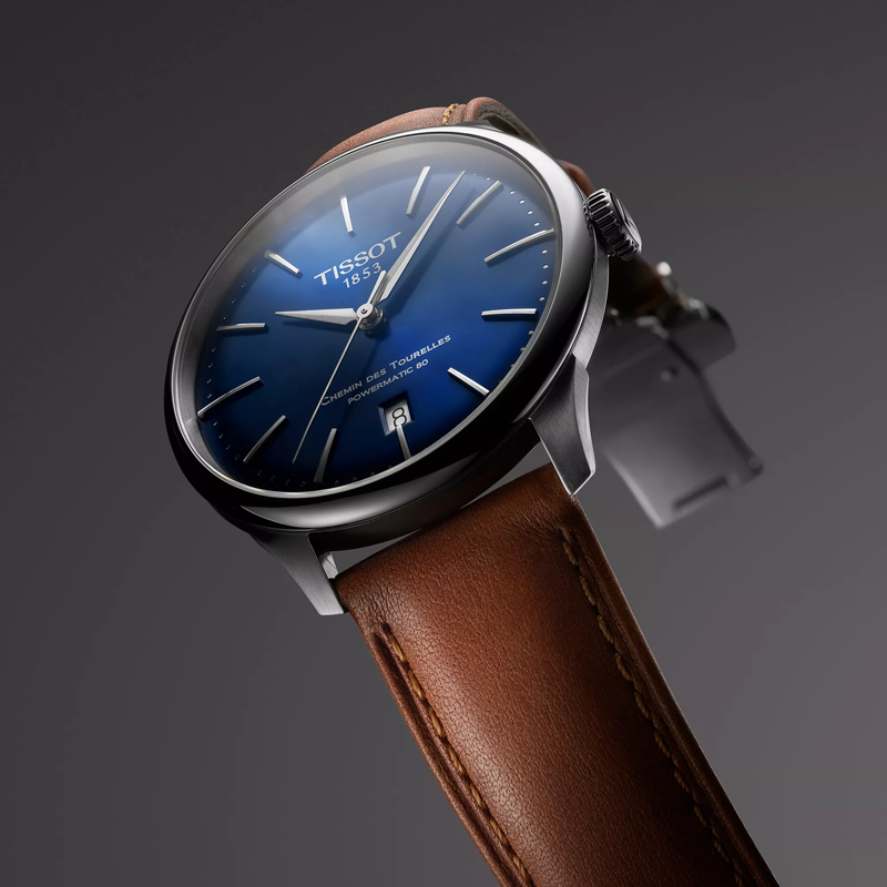 Tissot Chemin des Tourelles Powermatic 80 42 mm watch on a colored background
