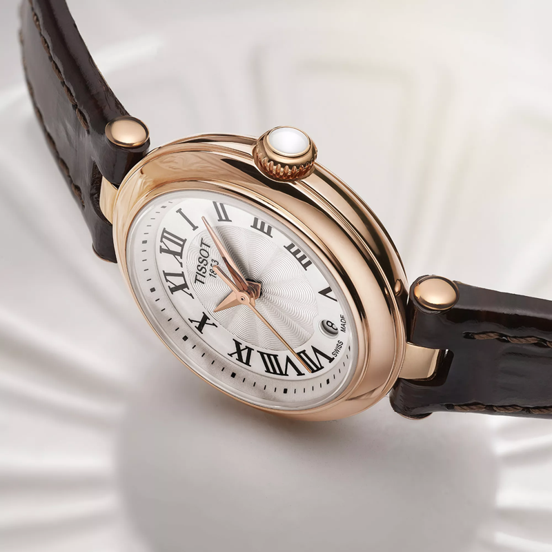 Tissot Bellissima small lady watch on a colored background