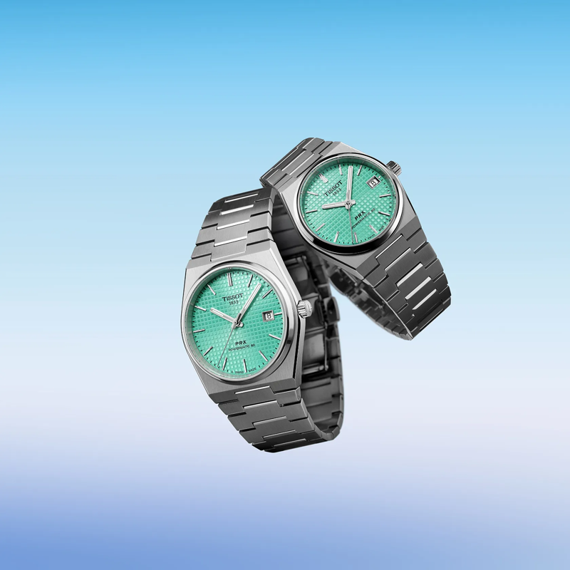 Tissot PRX Powermatic 80 35mm watch on a colored background