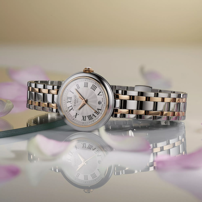 Tissot Bellissima Small Lady watch on a colored background