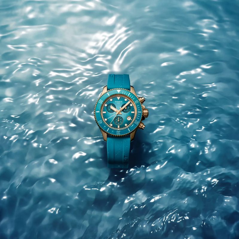 Tissot Seastar 1000 Quartz Chronograph 38mm watch on a colored background
