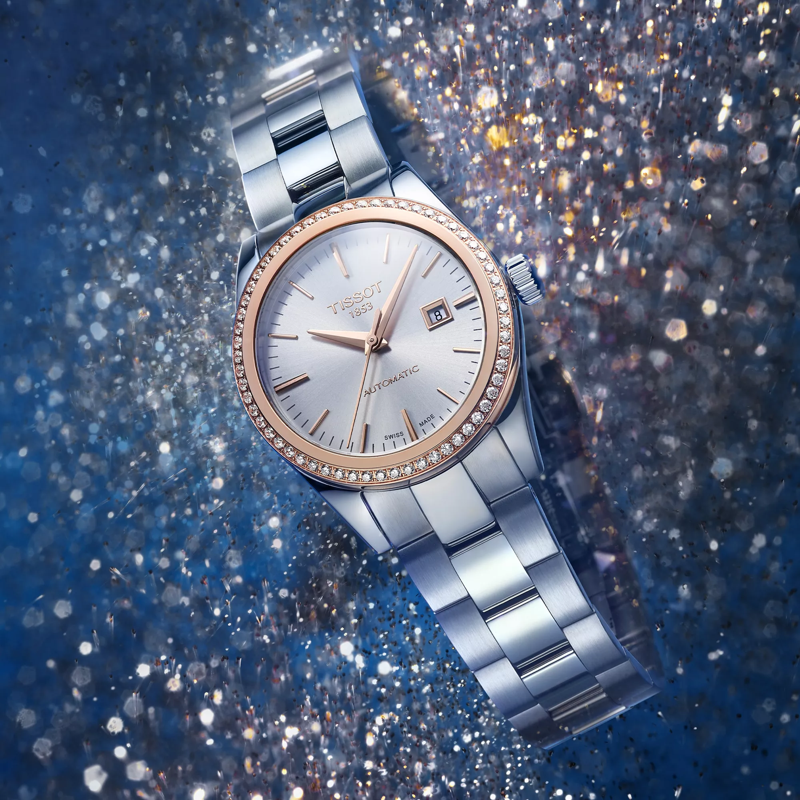 Tissot T-My Lady Automatic 18K Gold bezel montre sur fond coloré